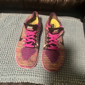 Women’s purple Nike running/training shoes